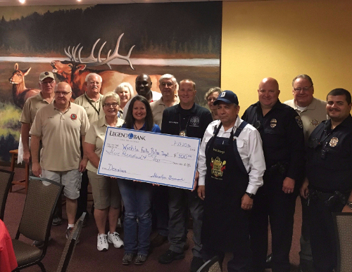 Image of group of people receiving check